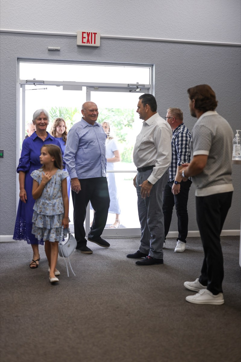 Members of the welcome team greeting arrivals at the church doors