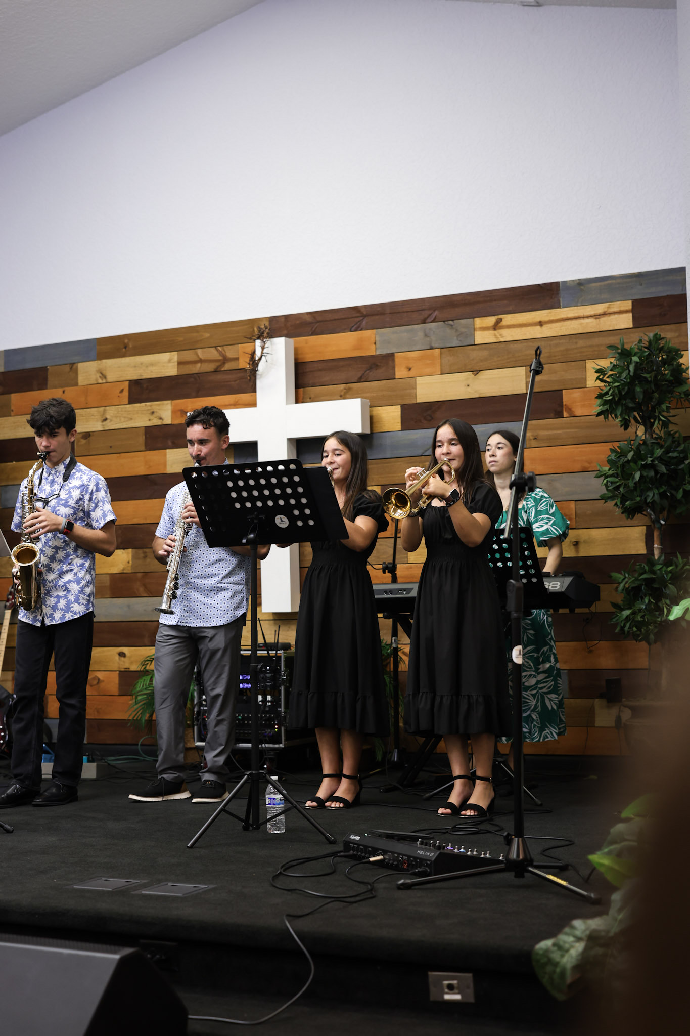 Students worshipping together on stage at Youth Conference